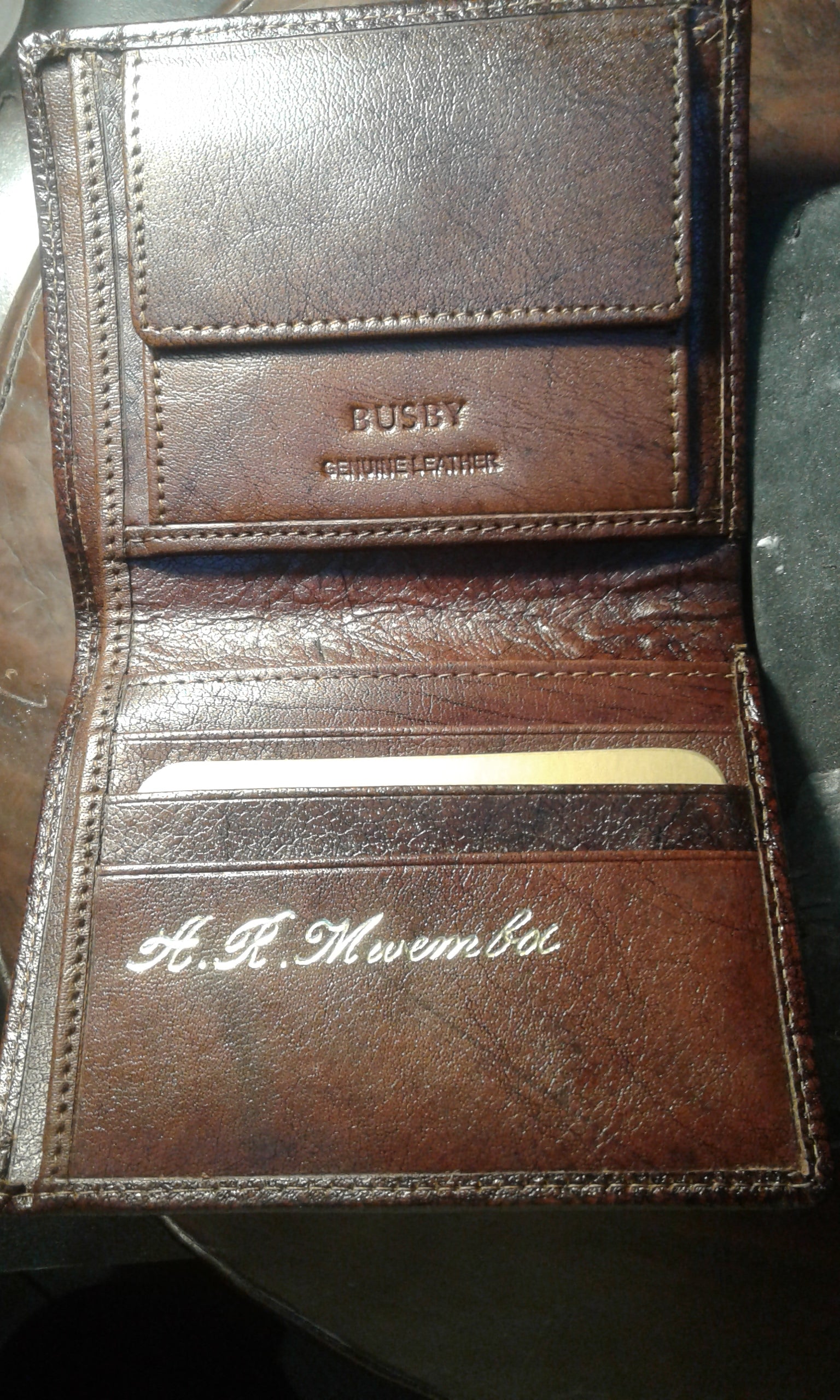 embossed wallets diaries briefcases while u wait- embossing in this pic R100